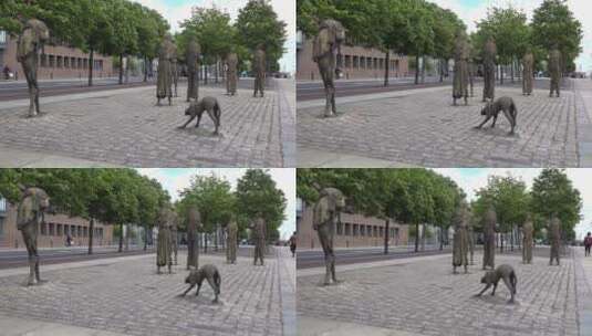 街道边饥荒者和狗的雕像高清在线视频素材下载