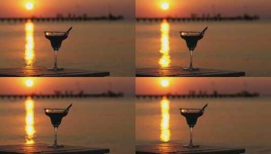 日落时的热带鸡尾酒杯高清在线视频素材下载