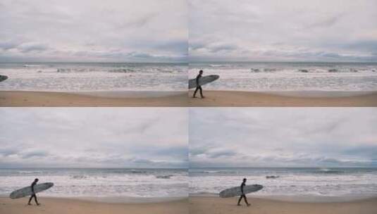 海边青年拿着冲浪板走过高清在线视频素材下载