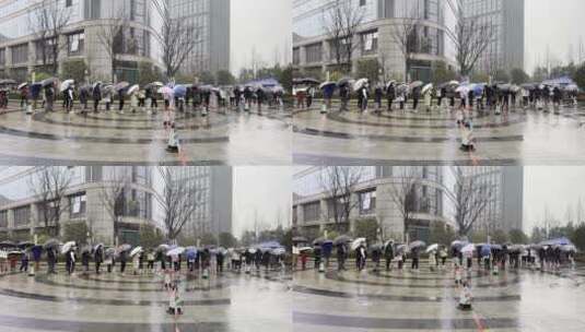 下雨天市民排队在城市广场上做核酸高清在线视频素材下载