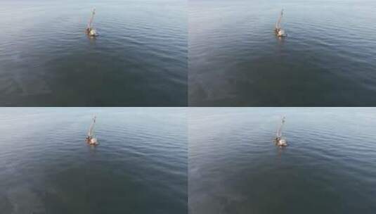 航拍威海高区海面上的一条航吊船高清在线视频素材下载