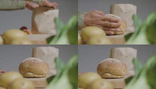 男人拿面包的特写镜头高清在线视频素材下载