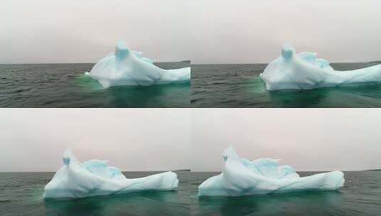 漂浮在海洋中的蓝色冰山高清在线视频素材下载