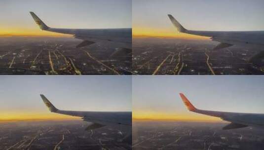 飞行中的飞机窗外日落和城市夜景景色高清在线视频素材下载