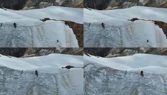 航拍攀登沙鲁里山脉尼登贡嘎雪山的登山者高清在线视频素材下载