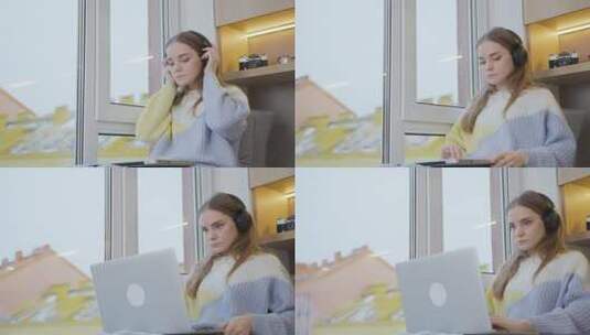 窗边的一个年轻女人戴上耳机，打开笔记本电脑，准备上班。高清在线视频素材下载