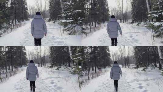 行走在雪地上的女人高清在线视频素材下载