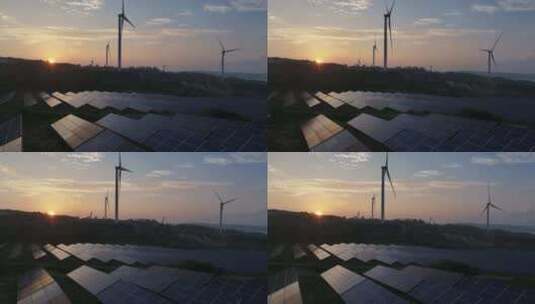 夕阳下风力发电场和太阳能光伏发电站航拍高清在线视频素材下载
