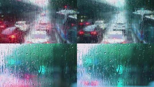 下雨玻璃上滴落的雨滴雨水映射五彩车灯高清在线视频素材下载