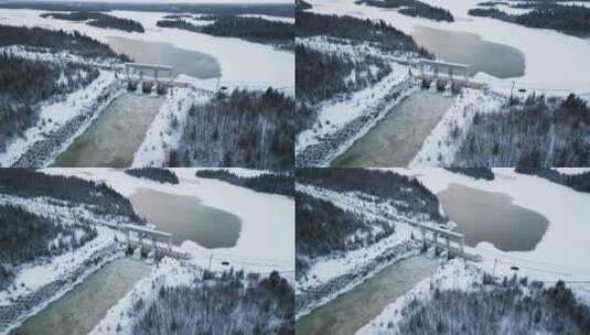 无人机拍摄冲水诺提吉水力发电湖大坝在多雪高清在线视频素材下载