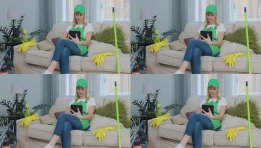 清理公寓后，穿着绿色围裙的迷人满意自信的高清在线视频素材下载