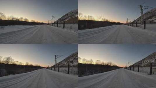 自驾在暮色苍茫的冰雪公路上高清在线视频素材下载