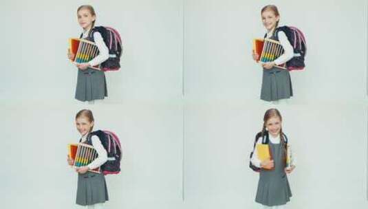 女孩背着书包拿着算盘和书籍高清在线视频素材下载