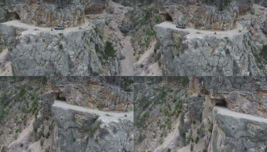 在多岩石的山路上行驶的车辆高清在线视频素材下载