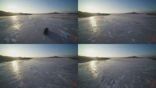 航拍东北平原冬天冰面阳光汽车高清在线视频素材下载