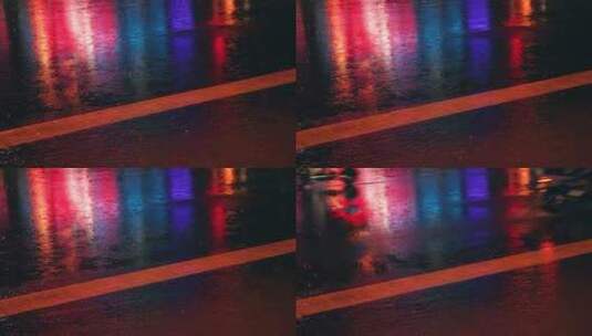 下雨天夜晚街道的雨水反射霓虹灯光高清在线视频素材下载