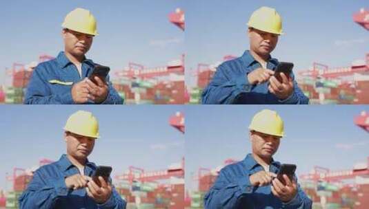 男性技术人员在货物港口码头使用手机高清在线视频素材下载