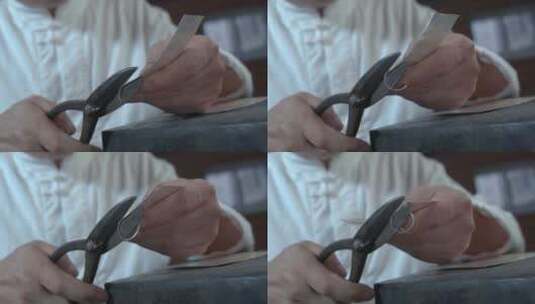 手工艺视频手工匠人锻银雕刻剪切银板慢镜头高清在线视频素材下载