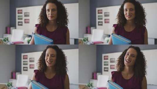 女人拿着书微笑高清在线视频素材下载