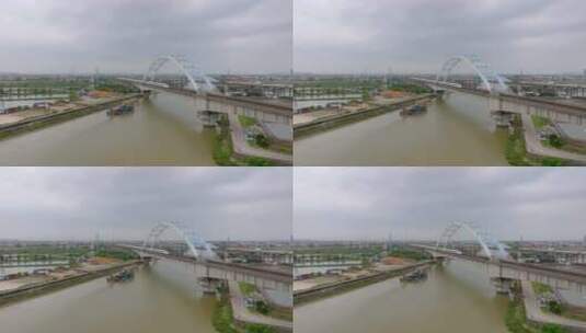 航拍高铁和谐号经过桥梁高清在线视频素材下载