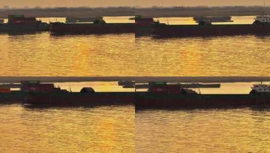 航拍夕阳落日江边飞鸟群飞轮船船队航行运输高清在线视频素材下载