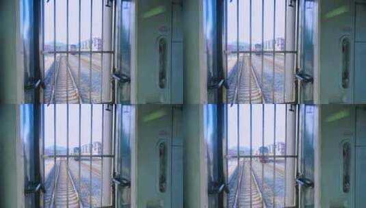 行驶中火车窗外的铁路站台与火车高清在线视频素材下载