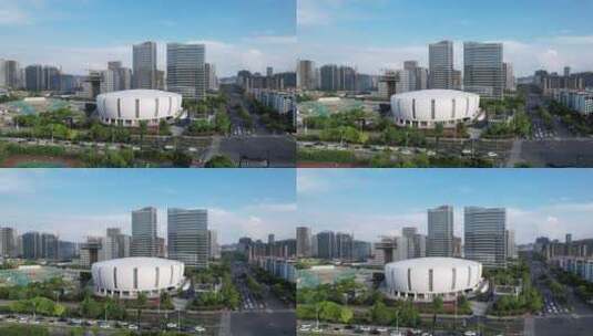航拍蓝天下杭州滨江体育馆和现代城市风光高清在线视频素材下载