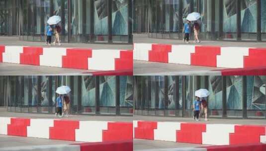 夏季打伞的行人遮阳伞高清在线视频素材下载
