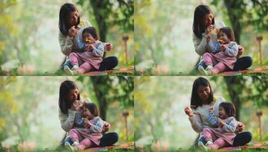 秋天公园里宝宝快乐玩耍小孩坐在妈妈怀里笑高清在线视频素材下载