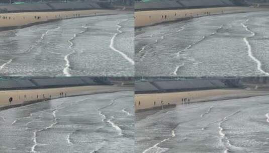 航拍威海金海滩海水浴场的海浪与海鸥高清在线视频素材下载