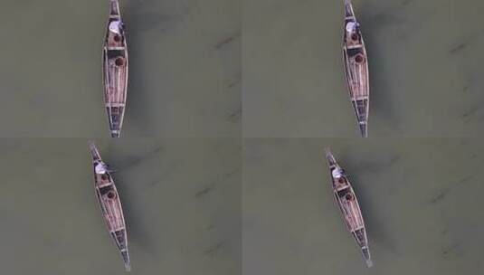漂浮在伊查马蒂河上的传统木船上孤独渔夫的鸟瞰图。Sl高清在线视频素材下载