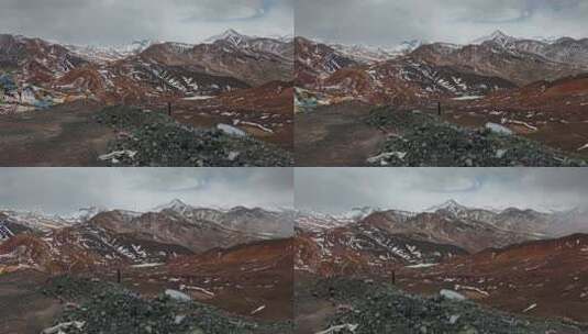西藏旅游风光云雾笼罩彩色冈底斯山残雪高清在线视频素材下载