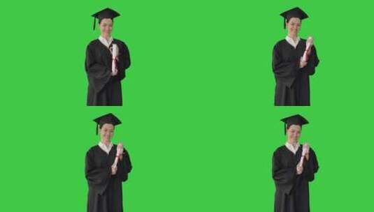 女学生在绿色屏幕上与文凭合影高清在线视频素材下载
