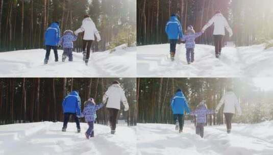 母亲带着孩子在雪地散步高清在线视频素材下载