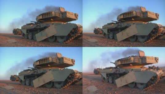 伊拉克沙漠中冒着黑烟的坦克高清在线视频素材下载