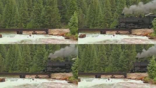 落基山脉咆哮的河流上蒸汽火车穿过桥梁高清在线视频素材下载