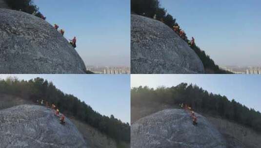 航拍消防员绳索攀岩训练高清在线视频素材下载