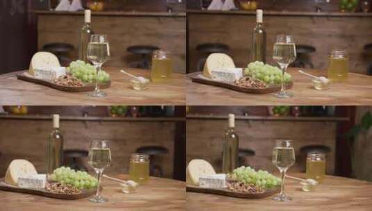 一瓶白葡萄酒一杯葡萄酒与奶酪相结合高清在线视频素材下载