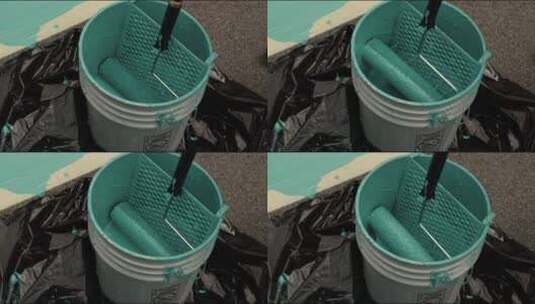 在油漆桶上蘸漆滚筒高清在线视频素材下载