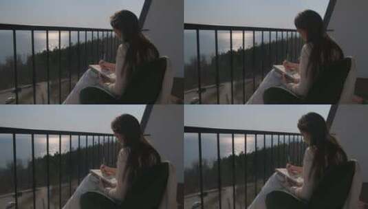 女孩在阳台上作画高清在线视频素材下载