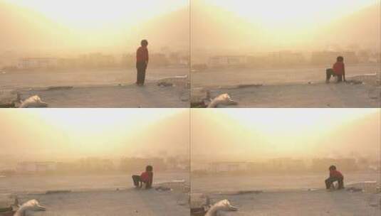 沙尘暴中男孩眺望喀布尔阿富汗高清在线视频素材下载