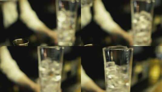 调酒师在玻璃杯里搅拌冰块高清在线视频素材下载