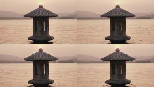 夕阳下波光粼粼的西湖和灯塔高清在线视频素材下载