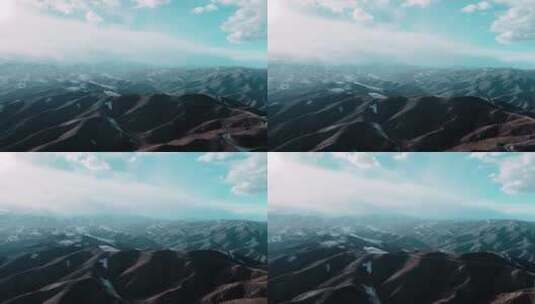蓝绿色的天白色的云青色的平原与山丘高清在线视频素材下载