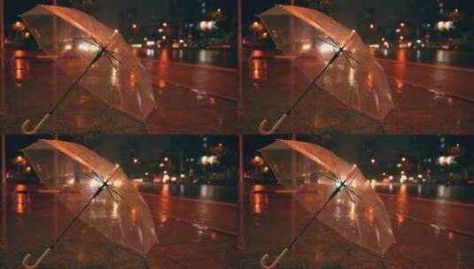 下雨街道边的透明雨伞高清在线视频素材下载