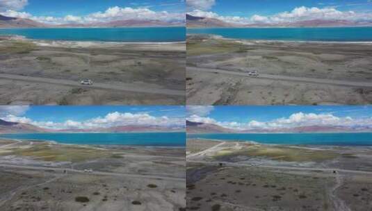 航拍越野车行驶在佩枯措湖边的土路上高清在线视频素材下载