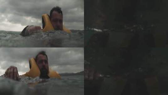 大海里穿着救生衣的男人高清在线视频素材下载