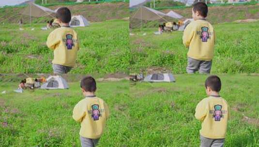 草坪上小男孩走路的背影 户外露营高清在线视频素材下载