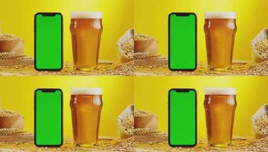 玻璃杯中的啤酒和手机对比的特写高清在线视频素材下载