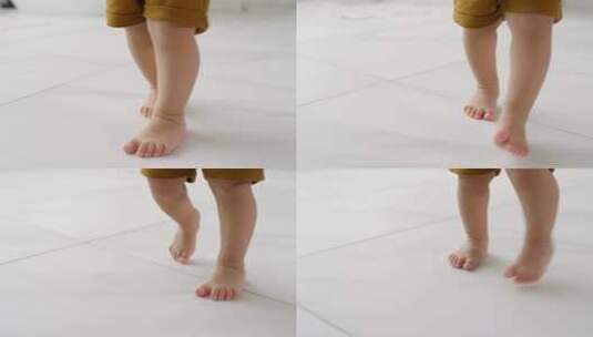 光脚婴儿在地板上学习走路！高清在线视频素材下载